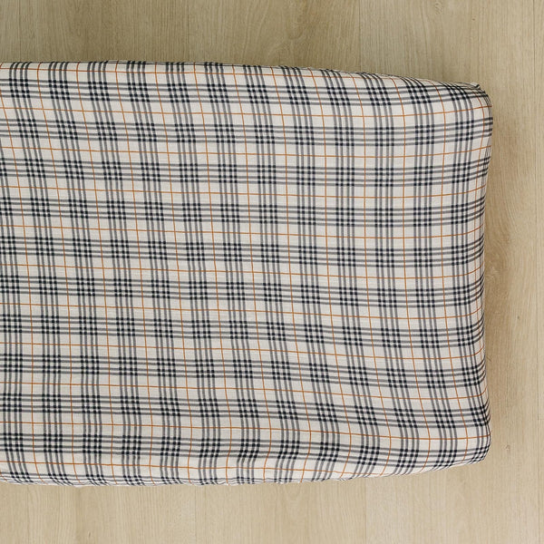 Mebie Baby vintage plaid changing pad cover adds soft, stylish comfort to diaper changes.