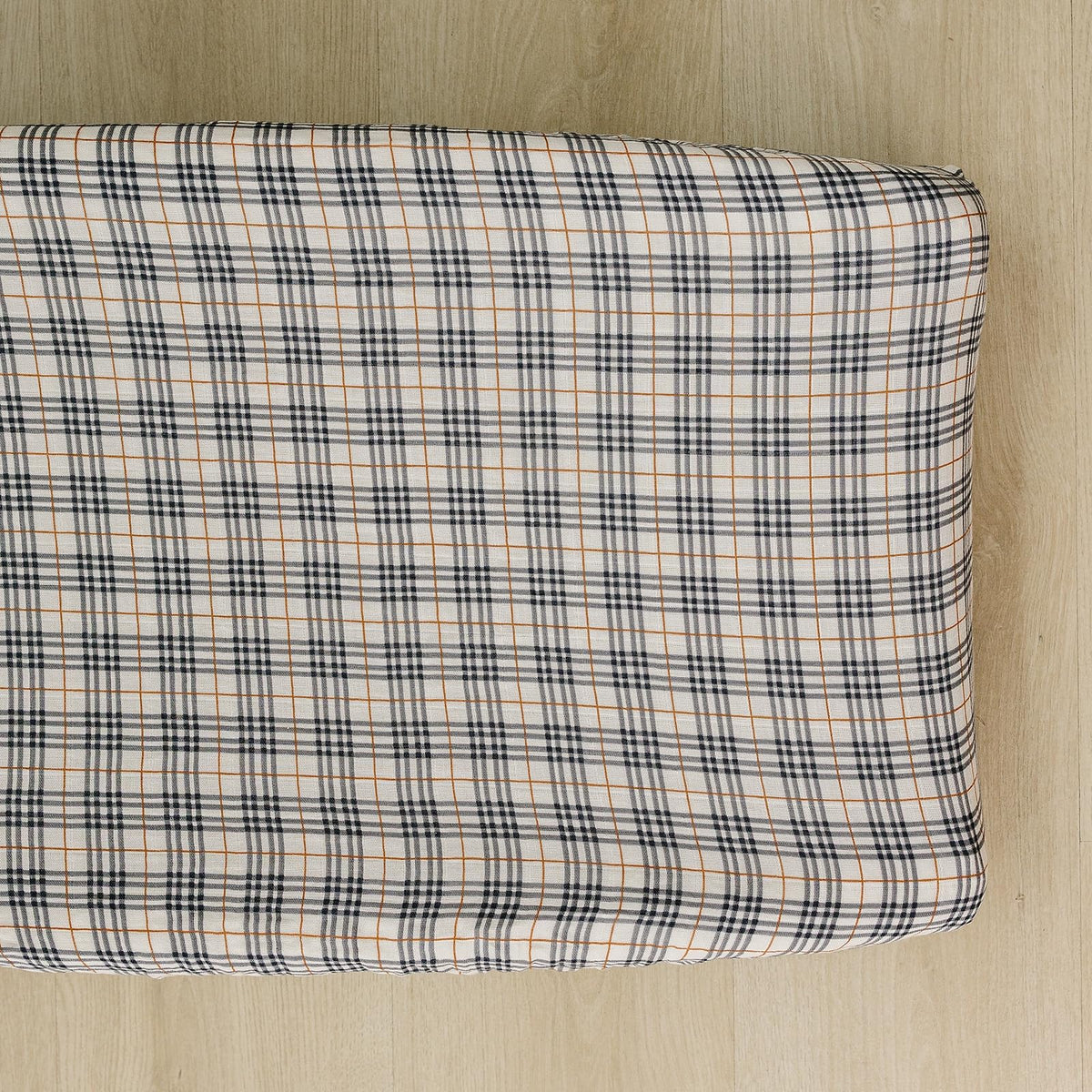 Mebie Baby vintage plaid changing pad cover adds soft, stylish comfort to diaper changes.