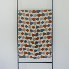 Mebie Baby Western Aztec Muslin Swaddle in use as a versatile wrap for comfort