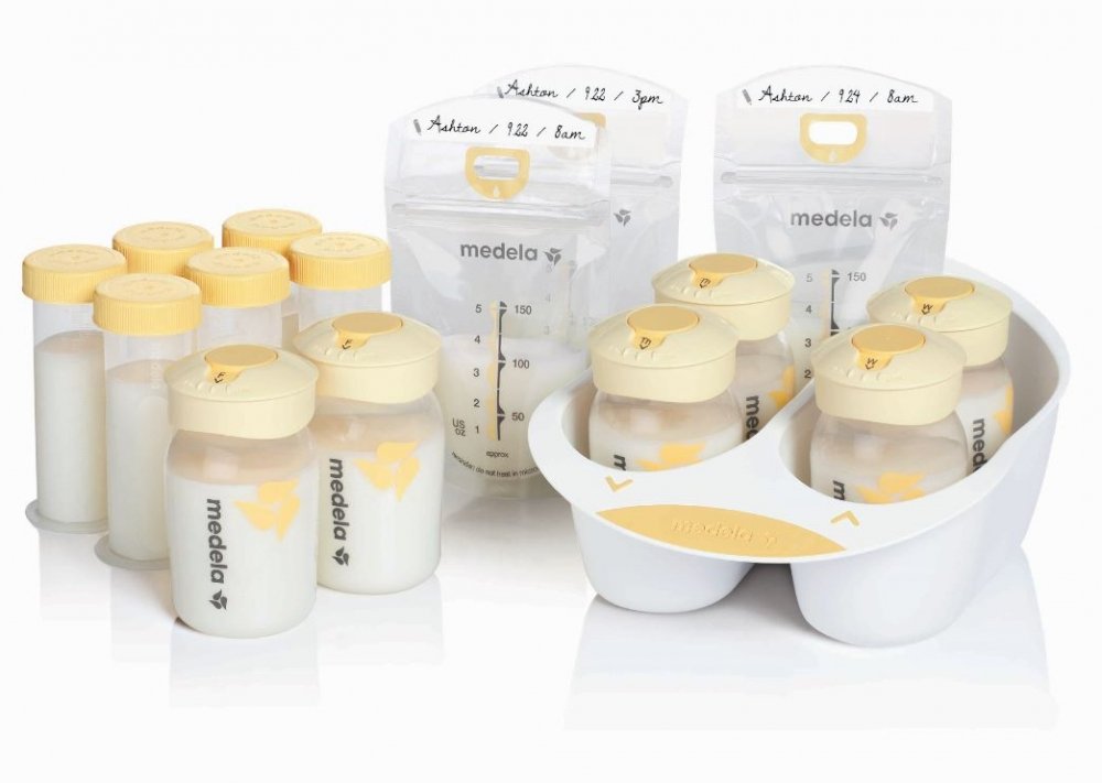 Medela breast milk storage bottles neatly arranged for easy feeding prep.