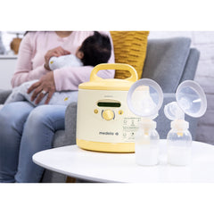 Medela Symphony Plus container stand keeping bottles organized during pumping routines.