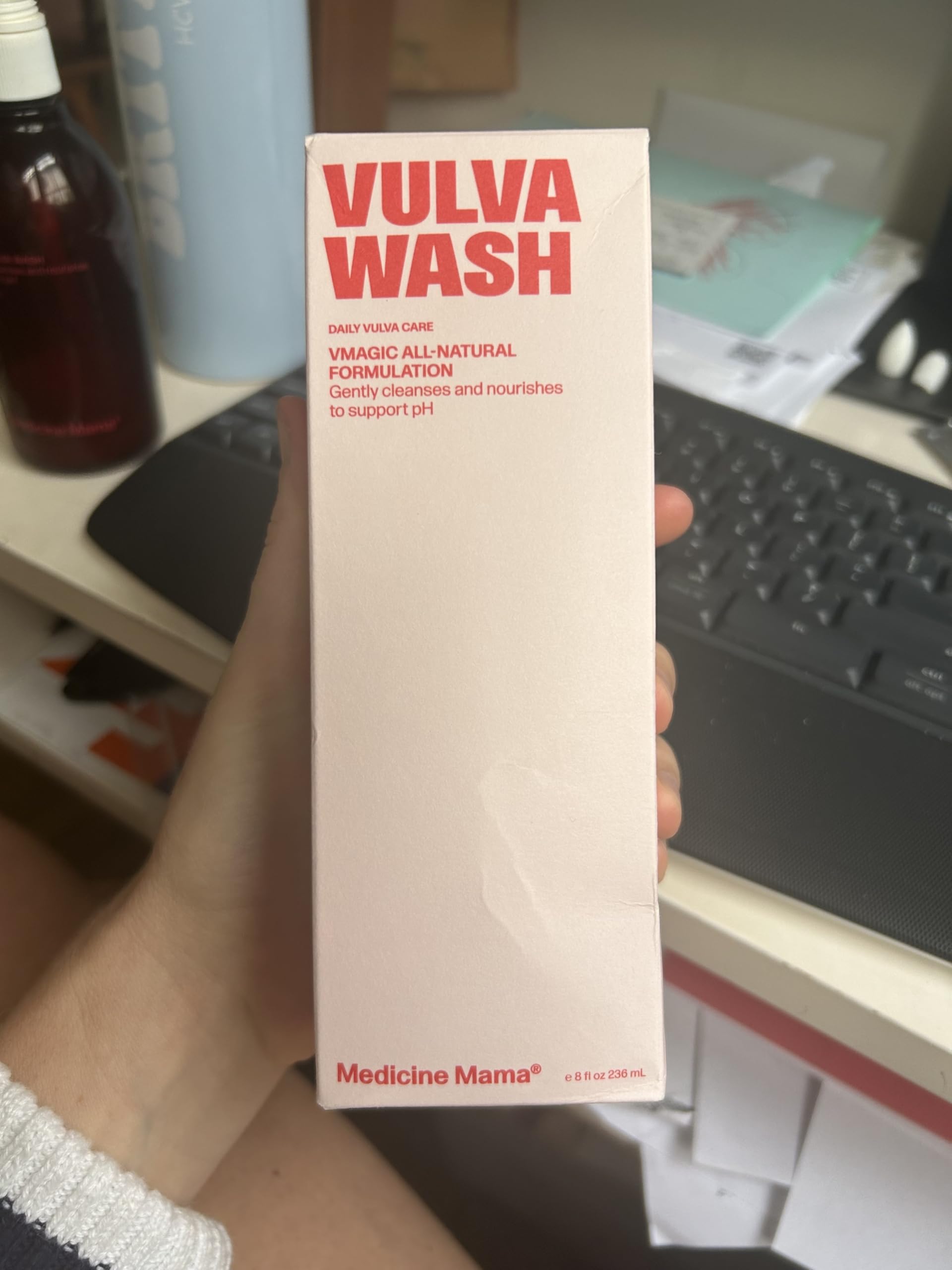 Travel-ready 8 oz bottle beside gym bag.