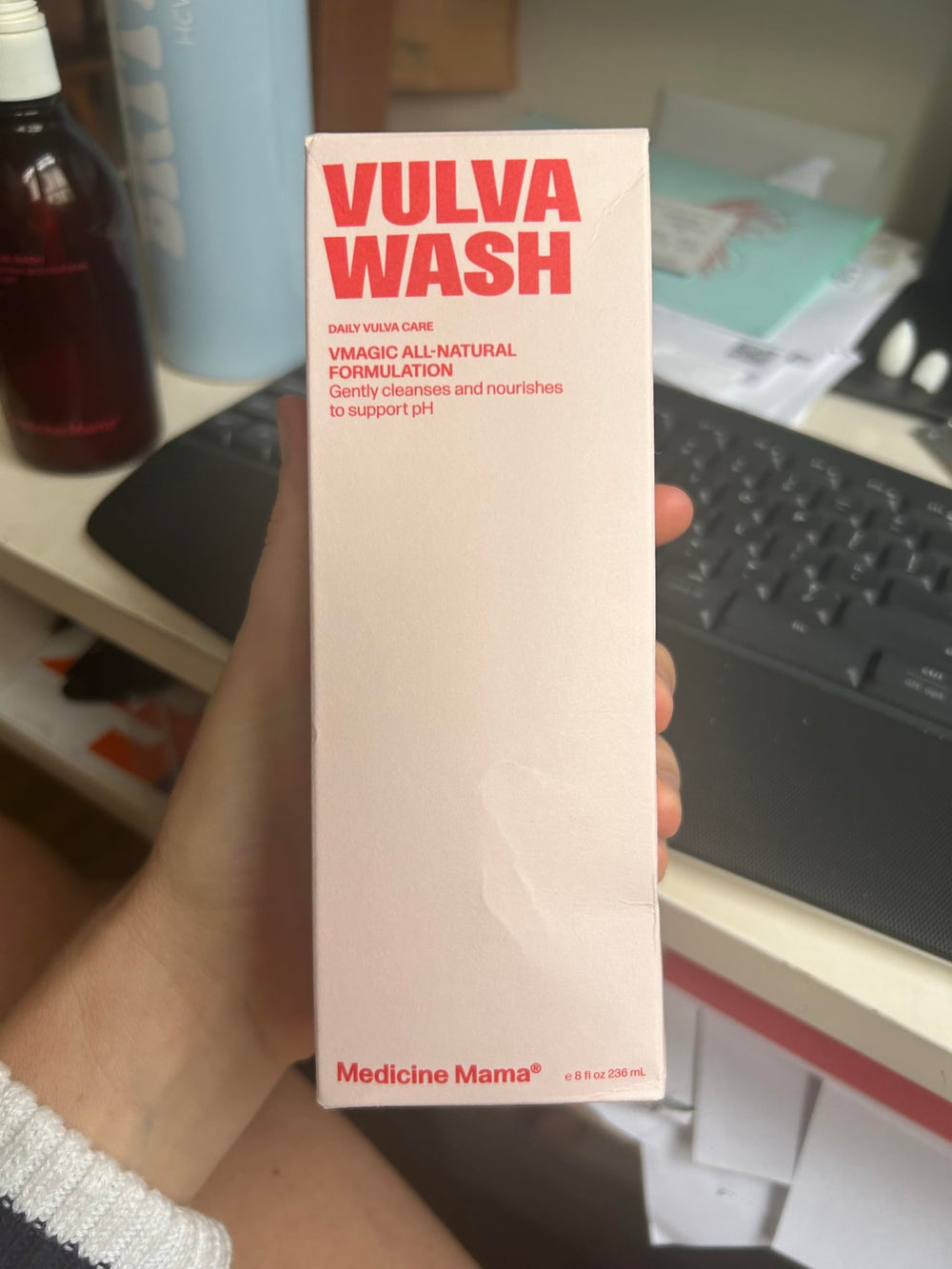 Travel-ready 8 oz bottle beside gym bag.