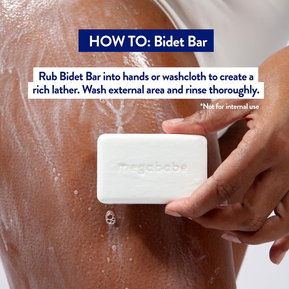 Megababe Bidet Bar lather in hand demonstrating external cleansing with smooth texture.
