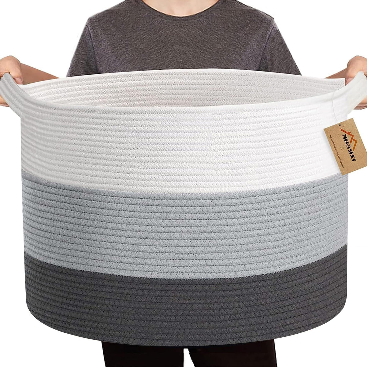 MEGASKET extra large cotton rope basket for blanket storage in a cozy living room.