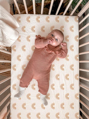 Meowcards bassinet sheet closeup of muslin texture highlighting breathability.