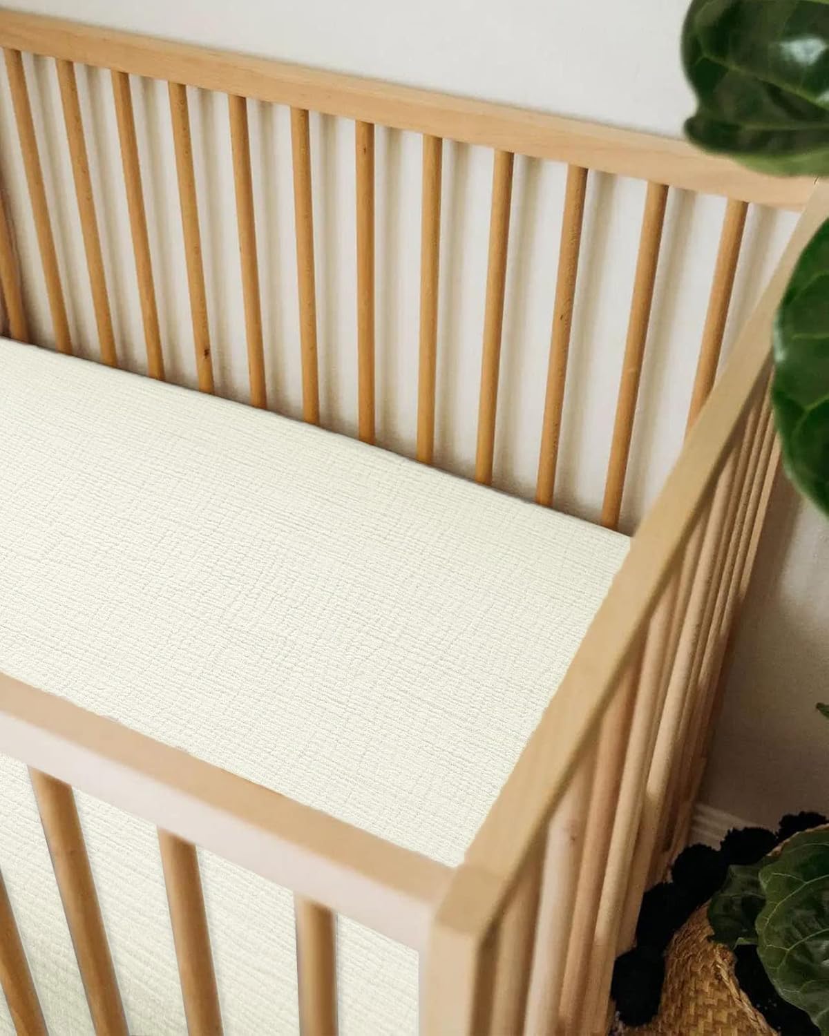 Meowcards bassinet sheet complements neutral nursery decor with versatile styling