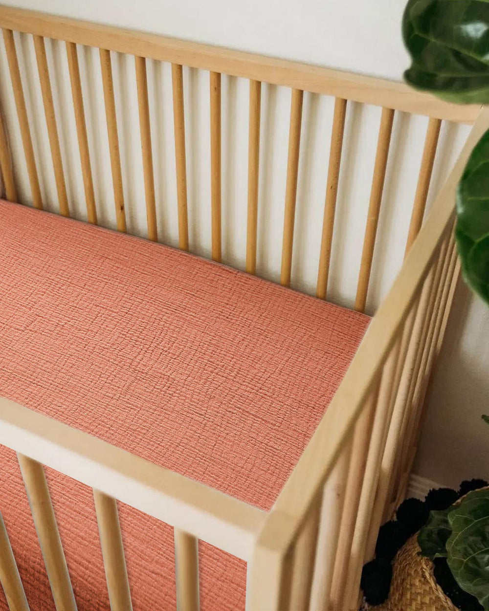 Meowcards bassinet sheet elastic-band secure fit close-up indicates easy, safe placement.