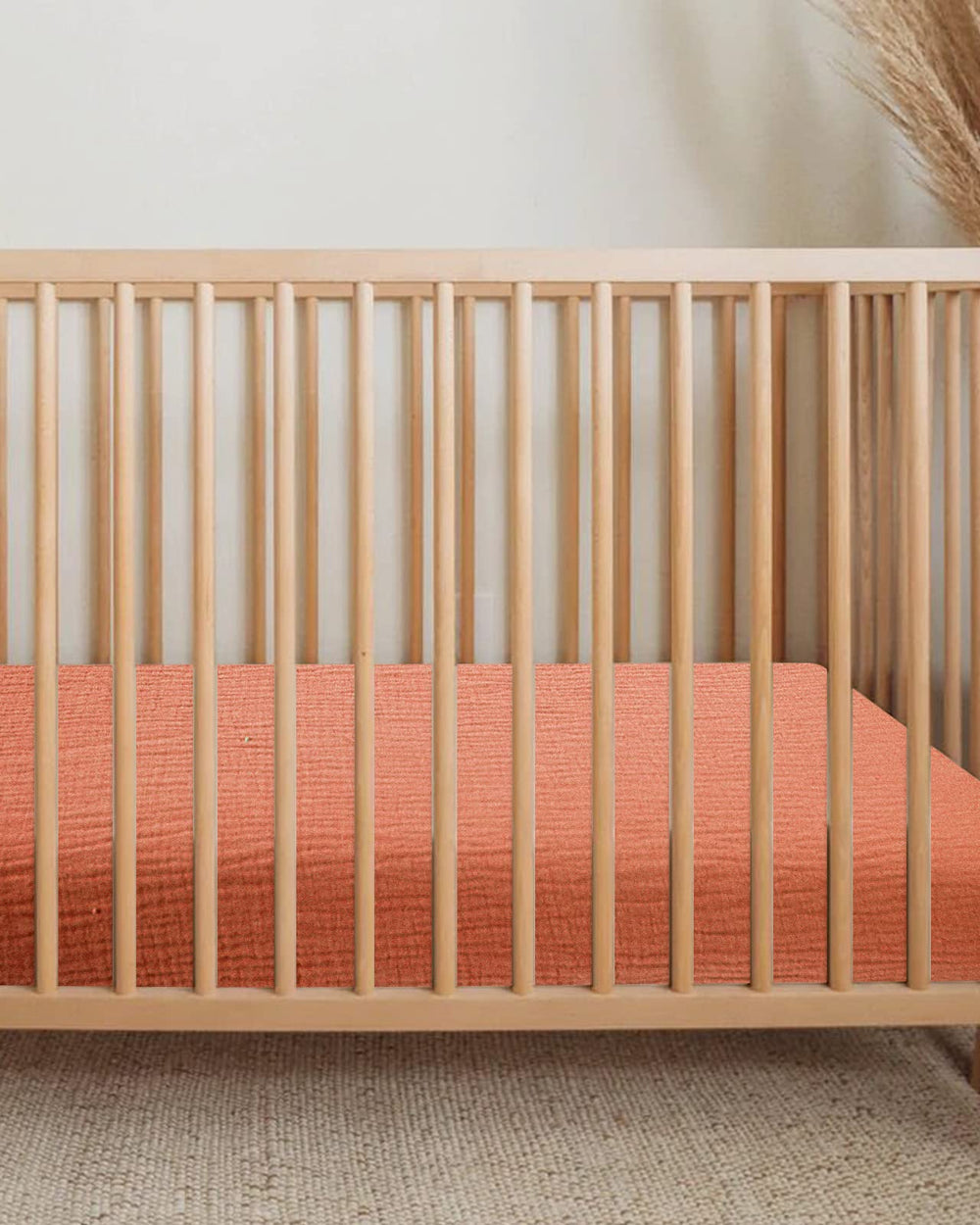 Meowcards bassinet sheet hourglass fit close-up demonstrates snug edge for stability.