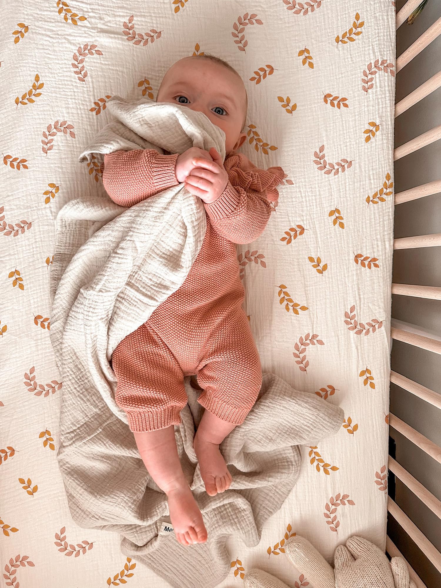 Meowcards bassinet sheet with leaf pattern adds calm style to the nursery.