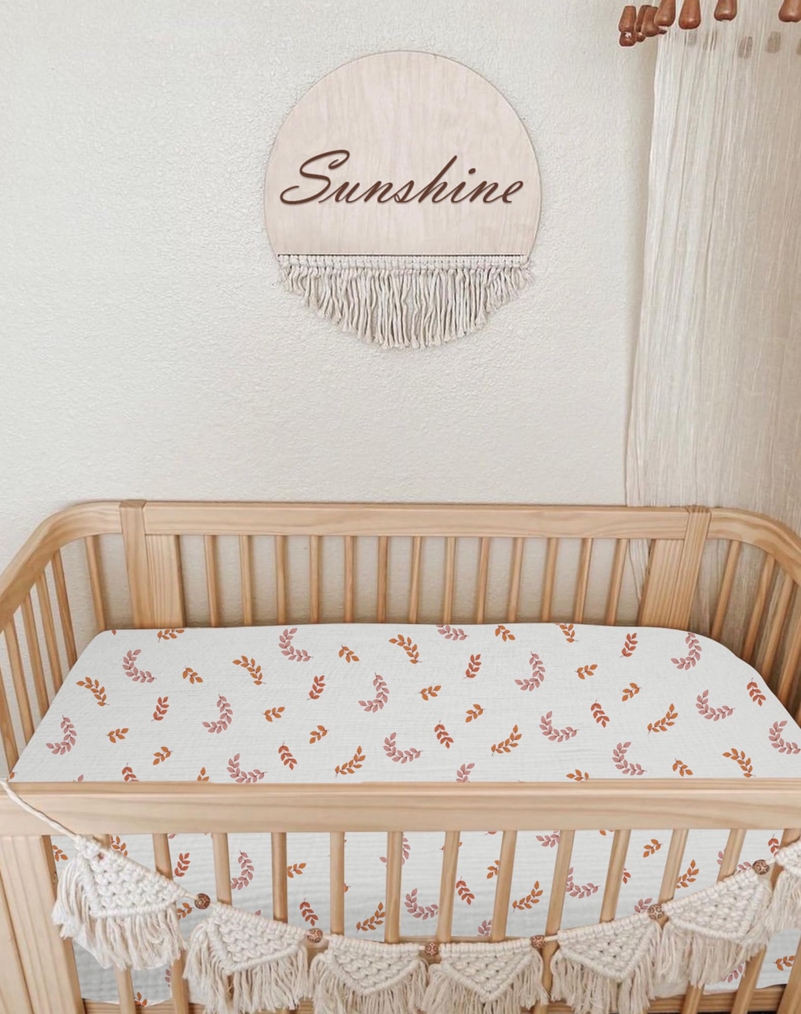Neutral leaf color Meowcards bassinet sheet complements nursery decor