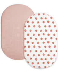 Meowcards bassinet sheet in strawberry and pale pink, soft muslin for gentle baby sleep.