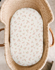 Meowcards rosy oval fit bassinet sheet with breathable muslin for comfortable nights.