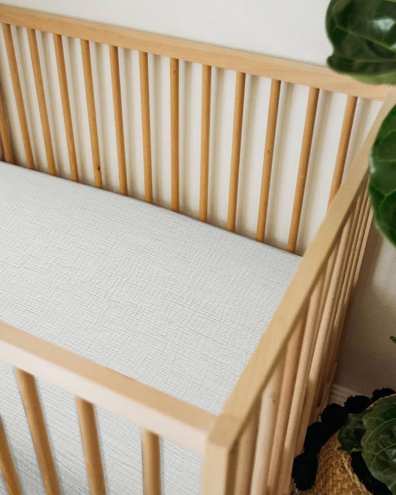 Meowcards bassinet sheet features elastic bottom band for a secure fit.