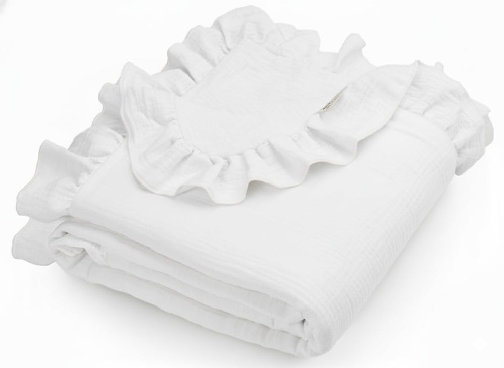Meowcards muslin swaddle with white ruffles for gentle newborn comfort.