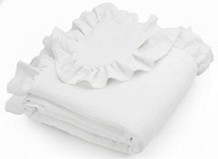 Meowcards muslin swaddle with white ruffles for gentle newborn comfort.