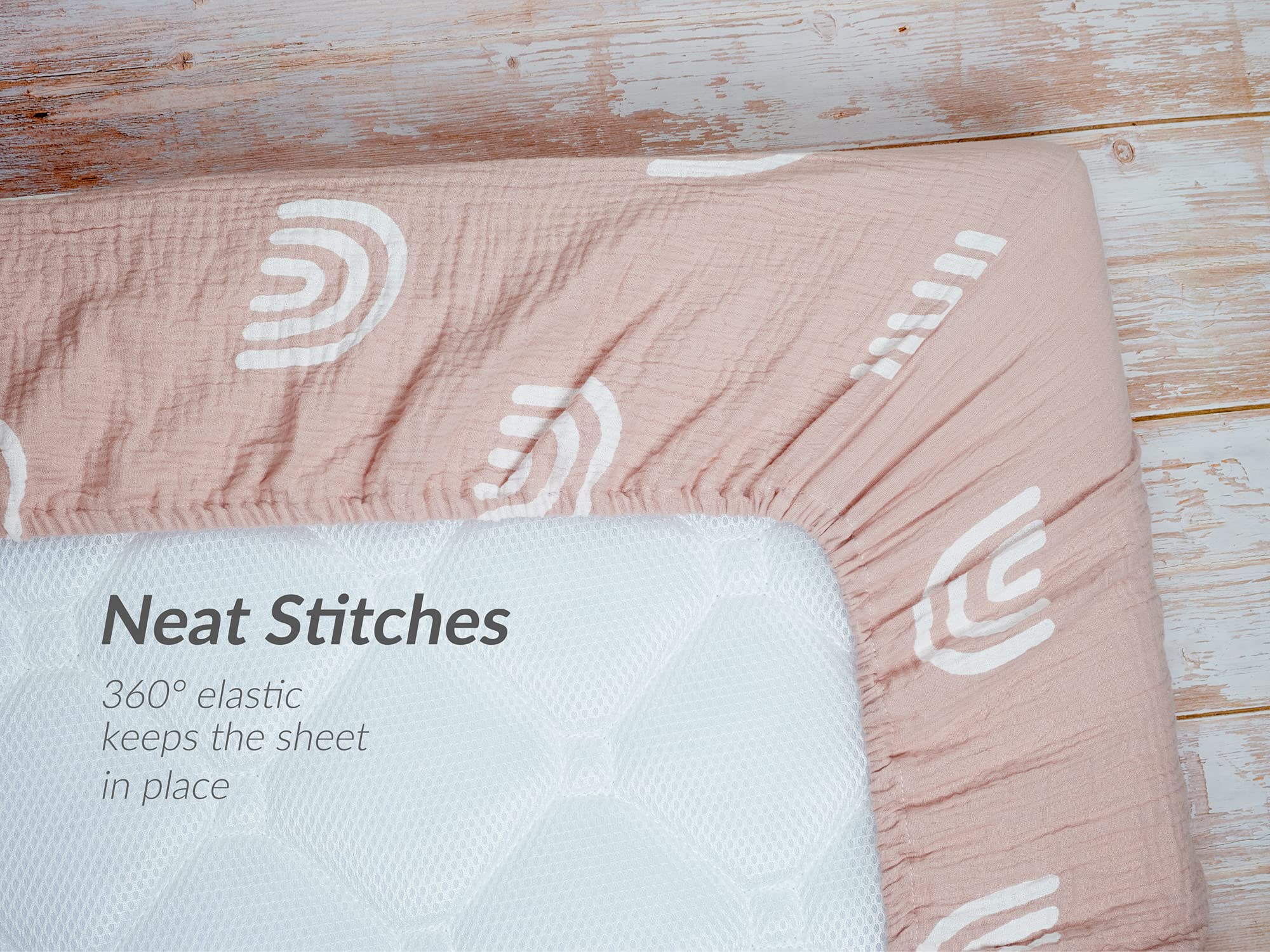 Meracorallo deep-pocket crib sheet secures mattresses up to nine inches.