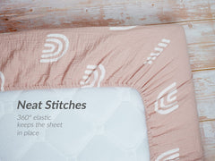 Meracorallo deep-pocket crib sheet secures mattresses up to nine inches.