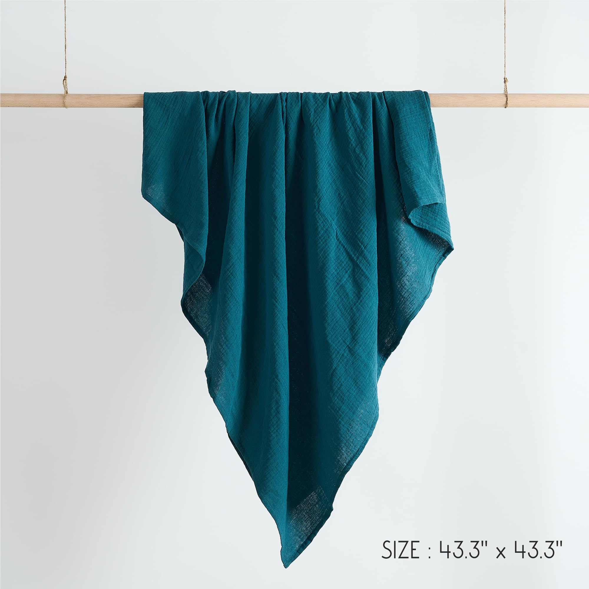 Meracorallo teal blanket suitable for nurseries, travels, and cozy moments.