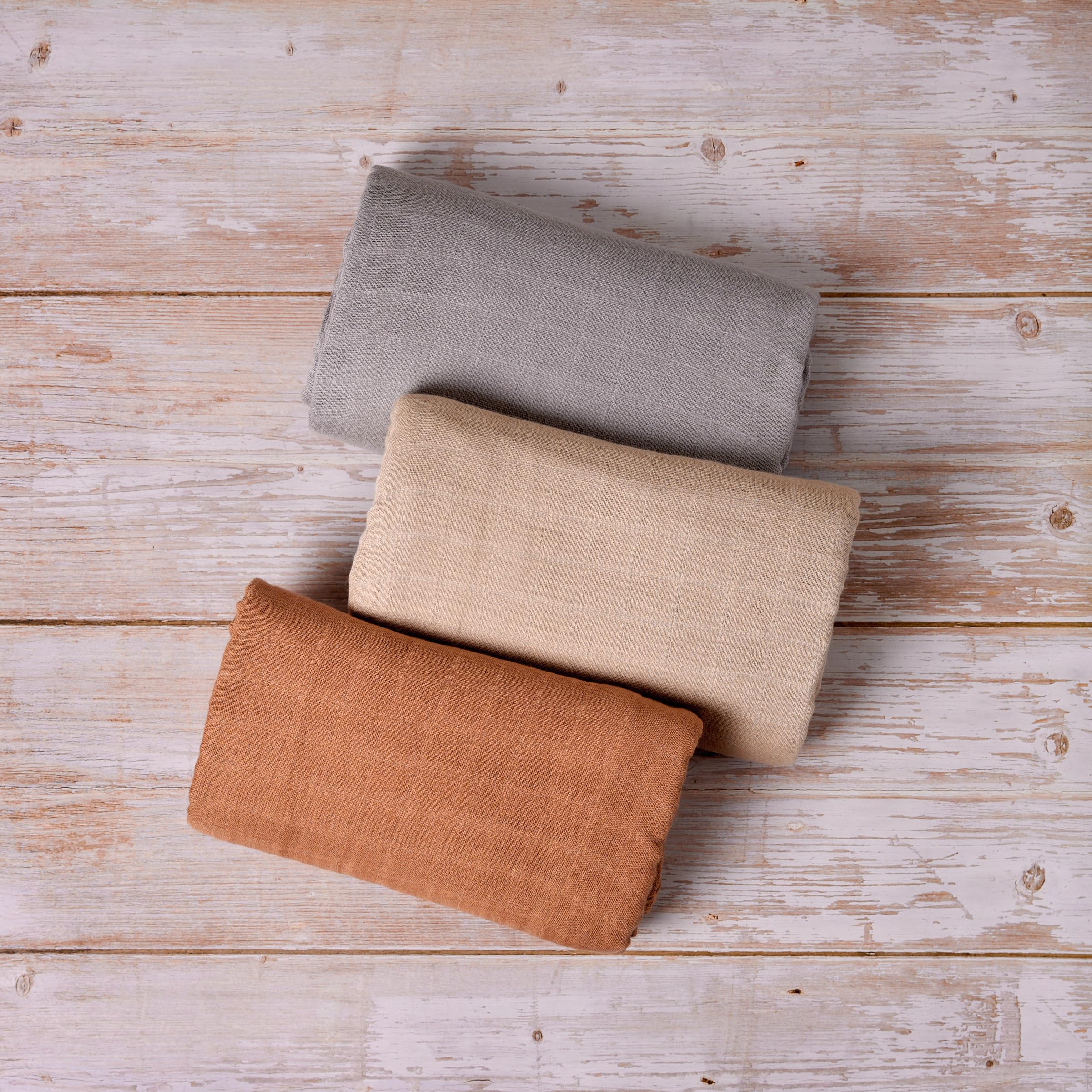Meracorallo muslin blanket 47x47 in camel color for versatile swaddling.