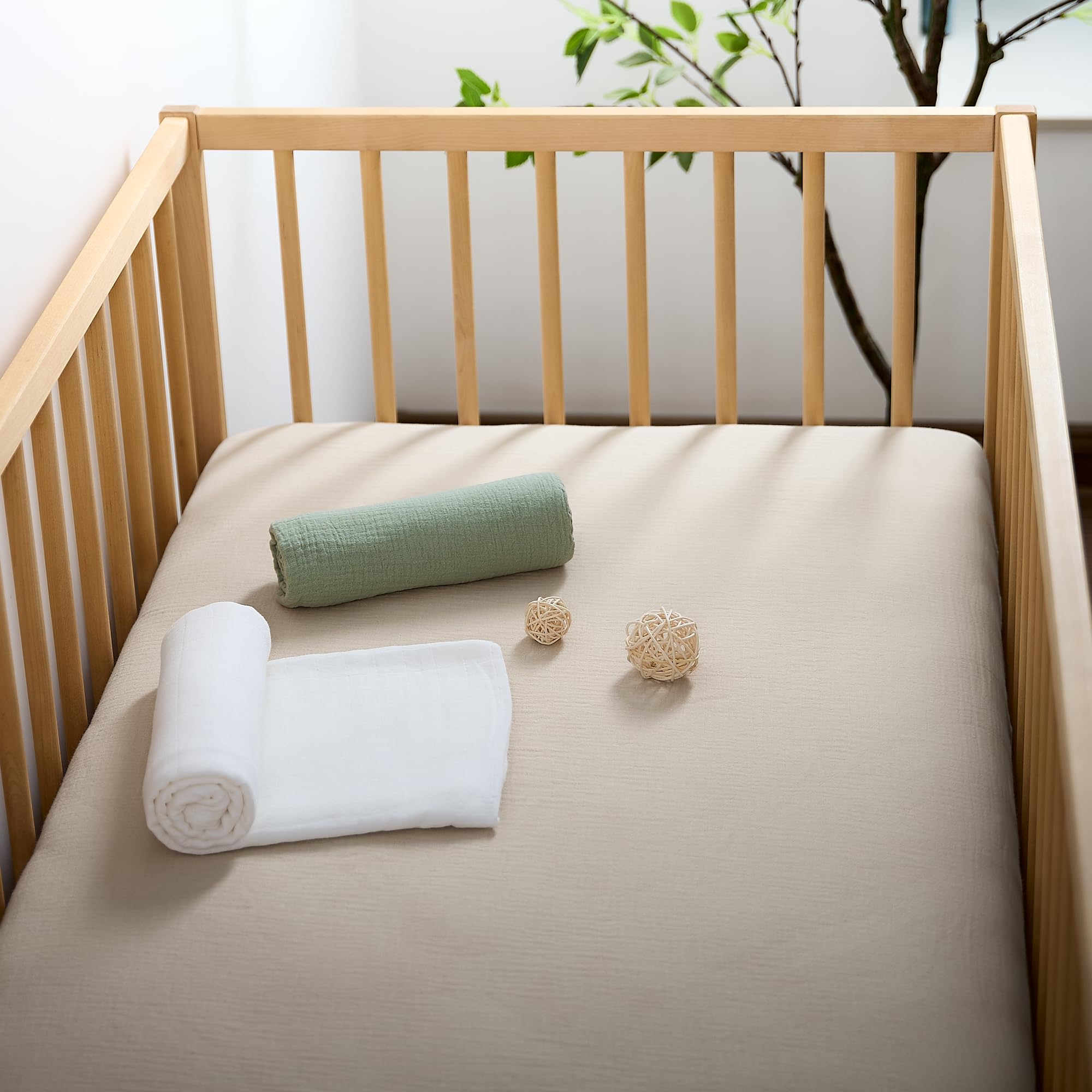 Beige tone of Meracorallo crib sheet adds a neutral, cozy nursery look.