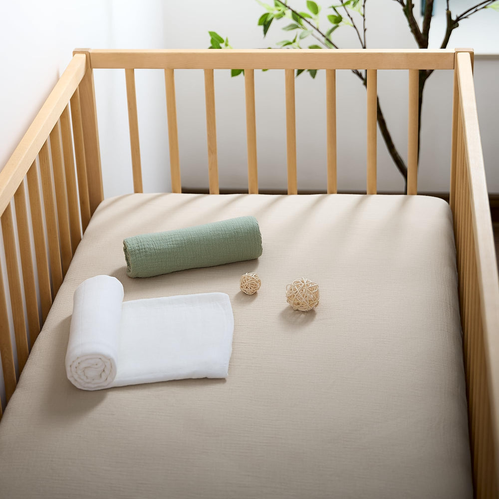 Beige tone of Meracorallo crib sheet adds a neutral, cozy nursery look.