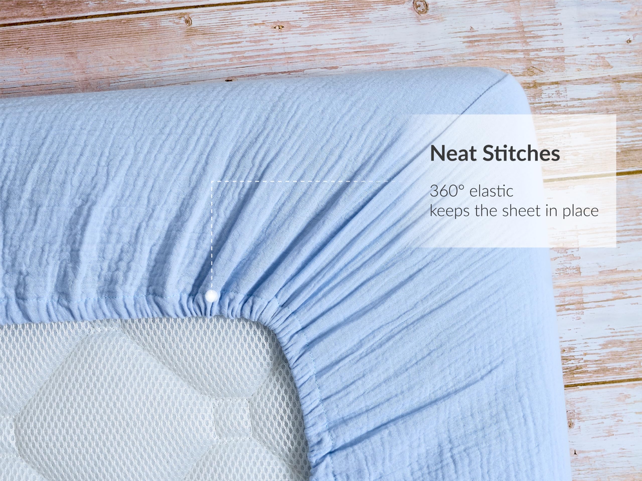 Meracorallo muslin crib sheet closeup showing soft cotton texture.
