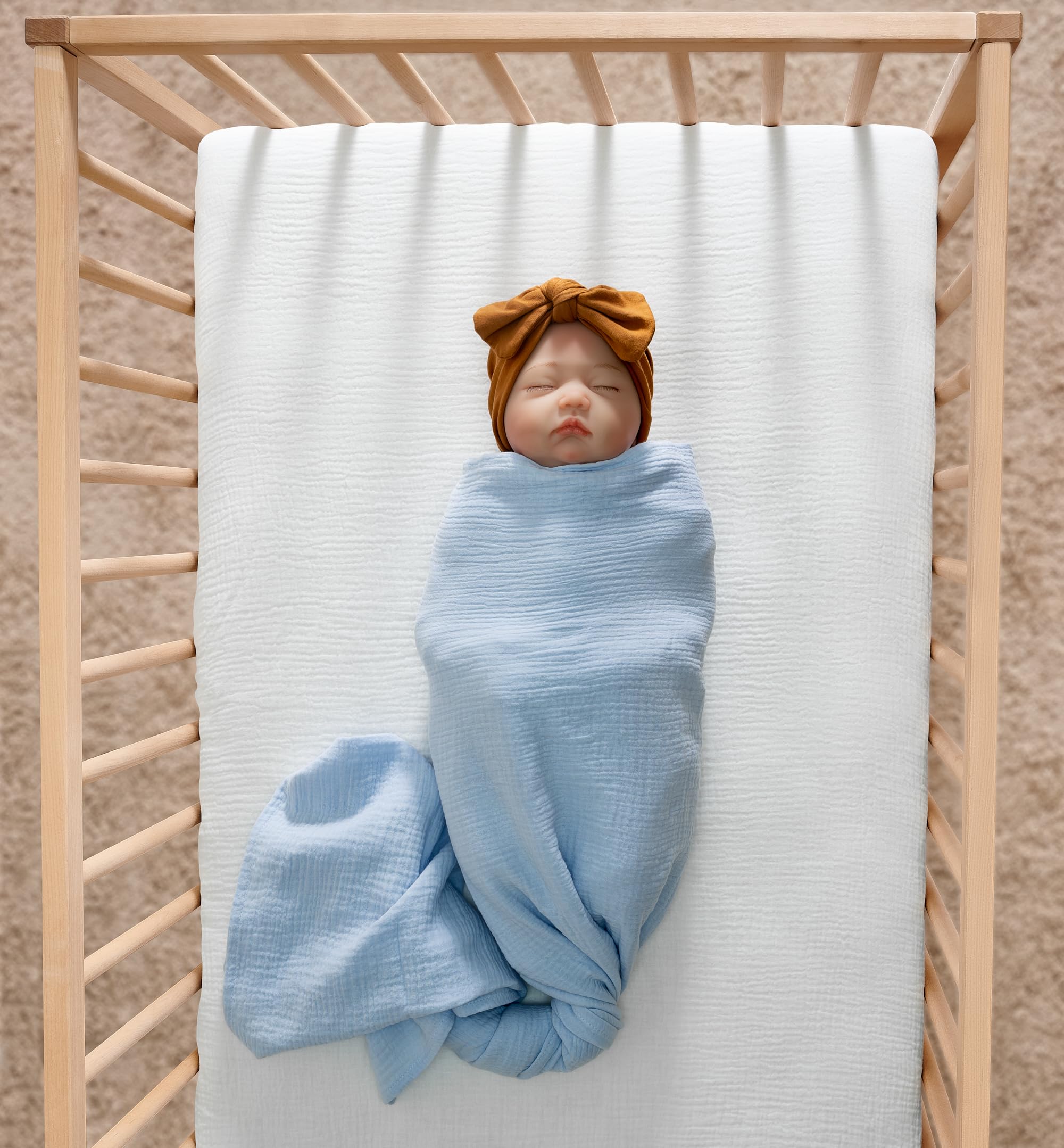 Meracorallo muslin crib sheet closeup soft fabric highlights breathable comfort for baby.