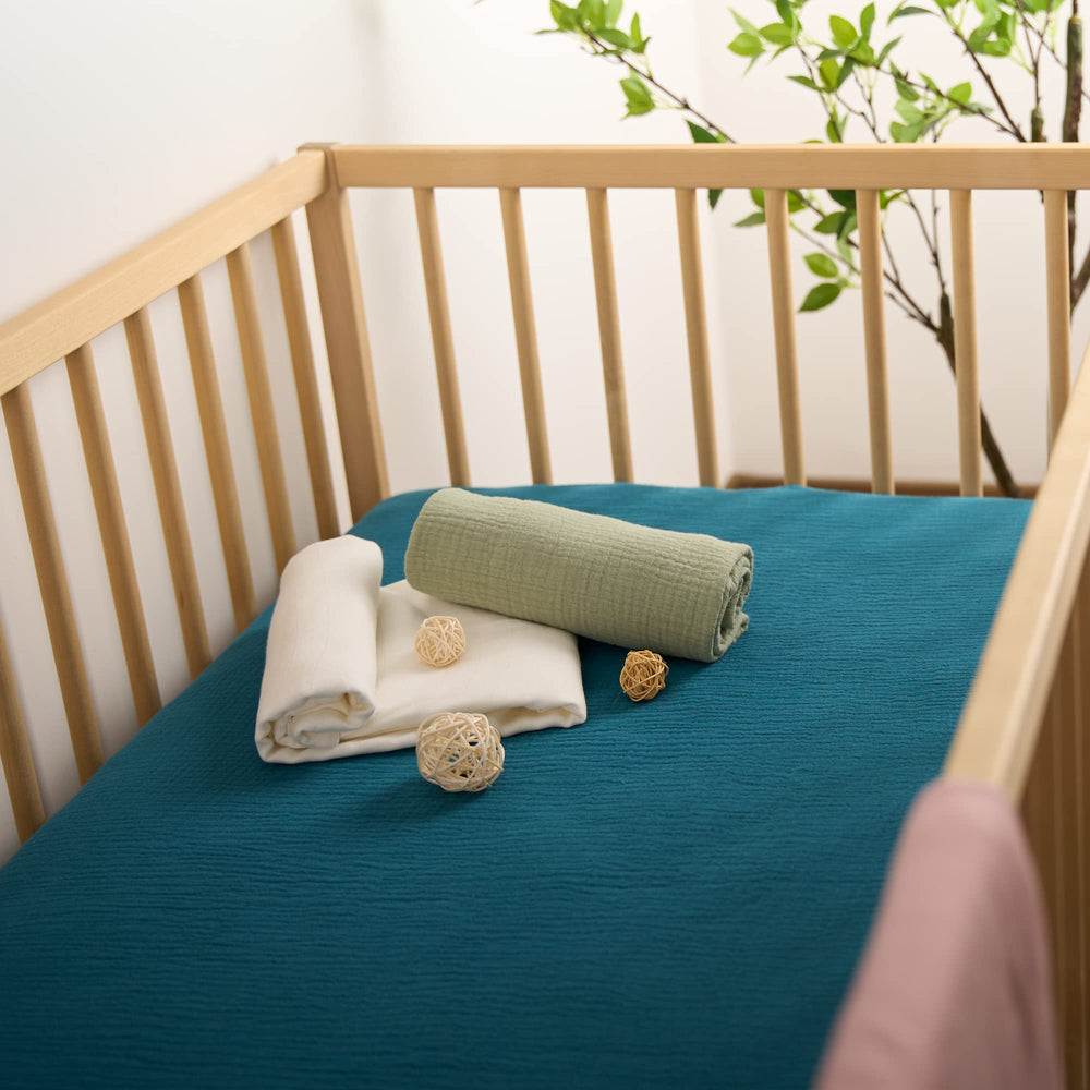 Meracorallo teal crib sheet ready for machine wash and tumble dry