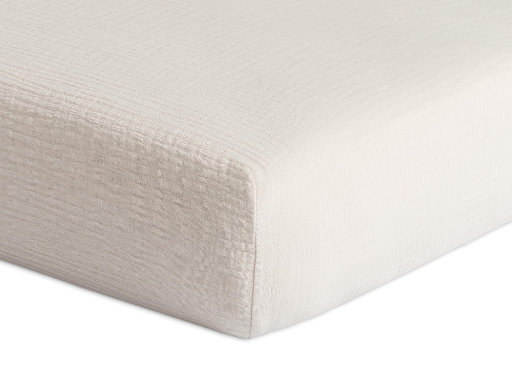 Meracorallo muslin fitted crib sheet fog, close-up reveals soft, pre-washed texture for gentle skin.
