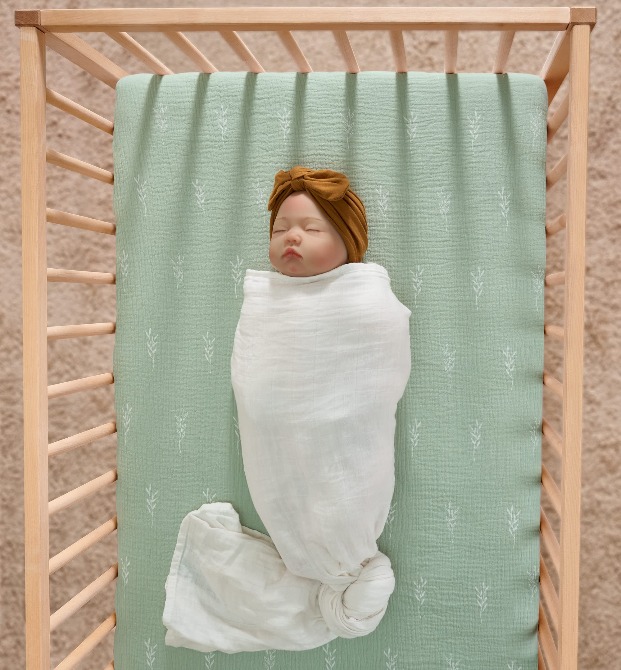 Meracorallo crib sheet green leaf pattern on mattress edge