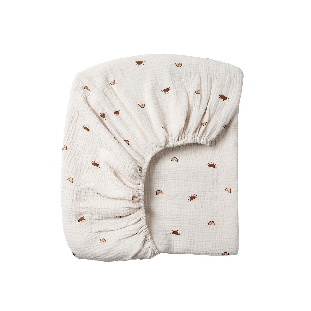 Meracorallo sun rainbow muslin crib sheet provides soft, breathable comfort.