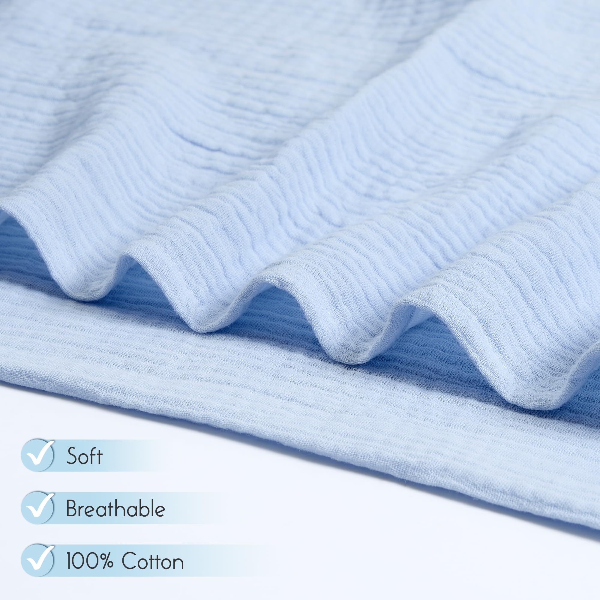 Baby wrapped in Meracorallo Muslin Swaddle Blanket, showcasing generous size for easy wrapping.