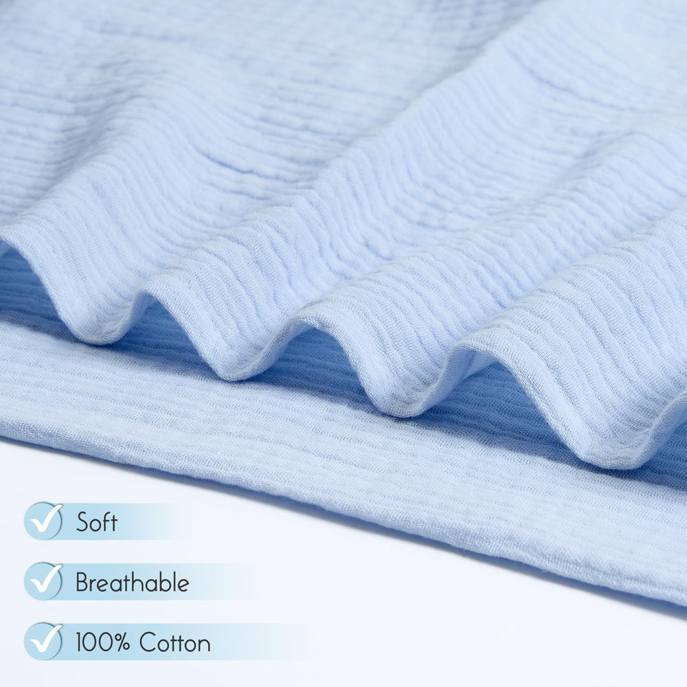 Baby wrapped in Meracorallo Muslin Swaddle Blanket, showcasing generous size for easy wrapping.