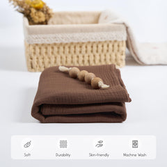 Meracorallo muslin blanket highlights versatile uses as receiving blanket and burp cloth.