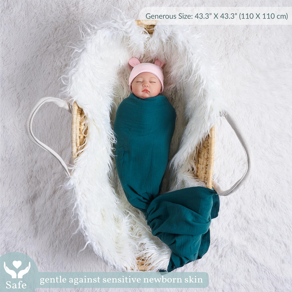 Meracorallo teal swaddle close-up texture highlights cotton quality and comfort.