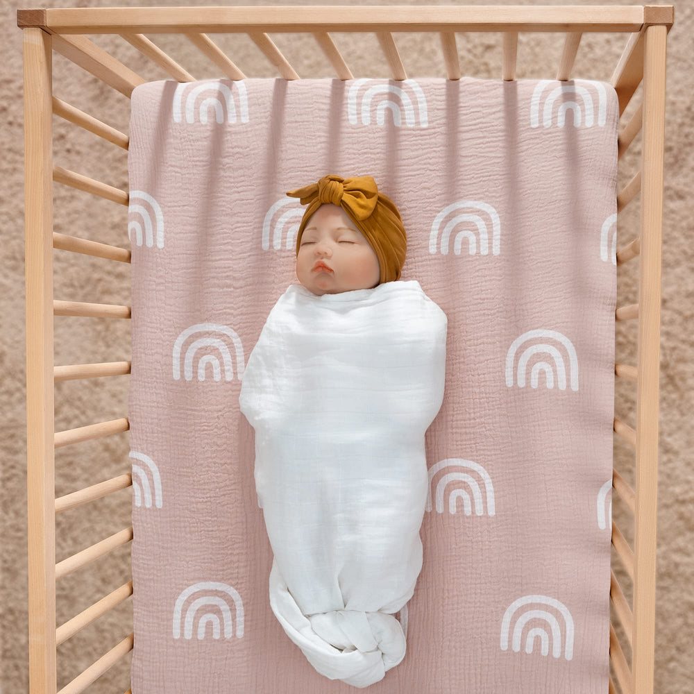 Meracorallo Rainbow Fog crib sheet on mattress provides breathable, comfortable sleep surface.