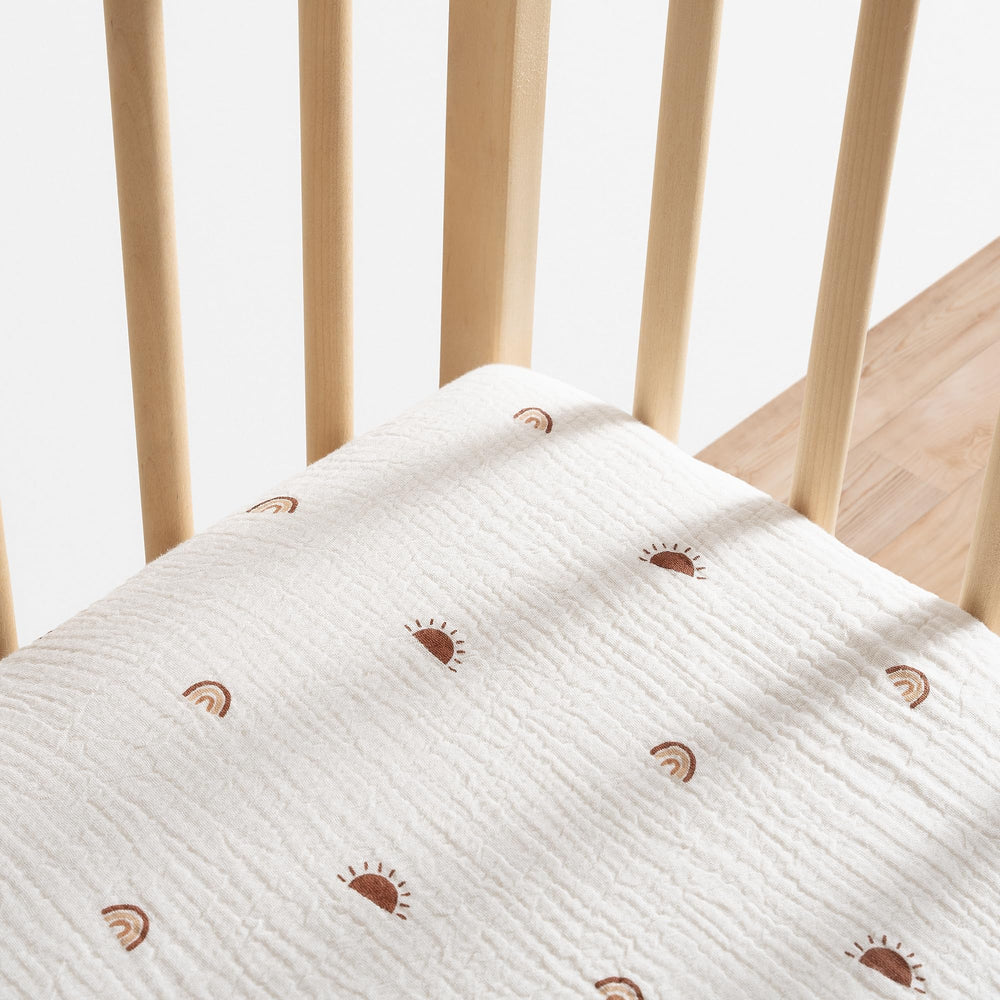 Meracorallo sun rainbow crib sheet covers the mattress edge to edge.
