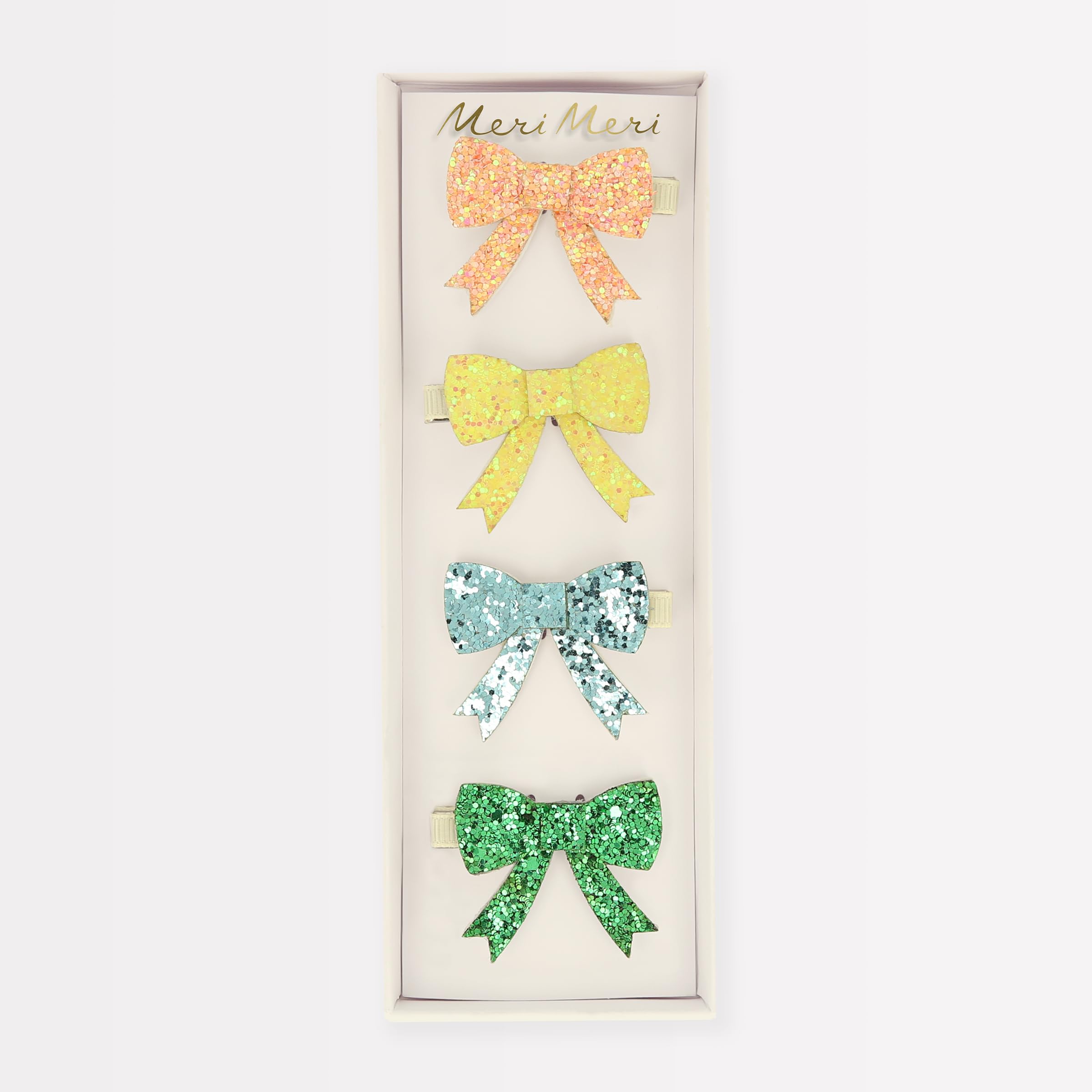 Meri Meri glitter bow hair clip close-up showcases chunky glitter texture