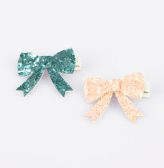 Meri Meri glitter bow hair clip in green adds fresh color to everyday wear