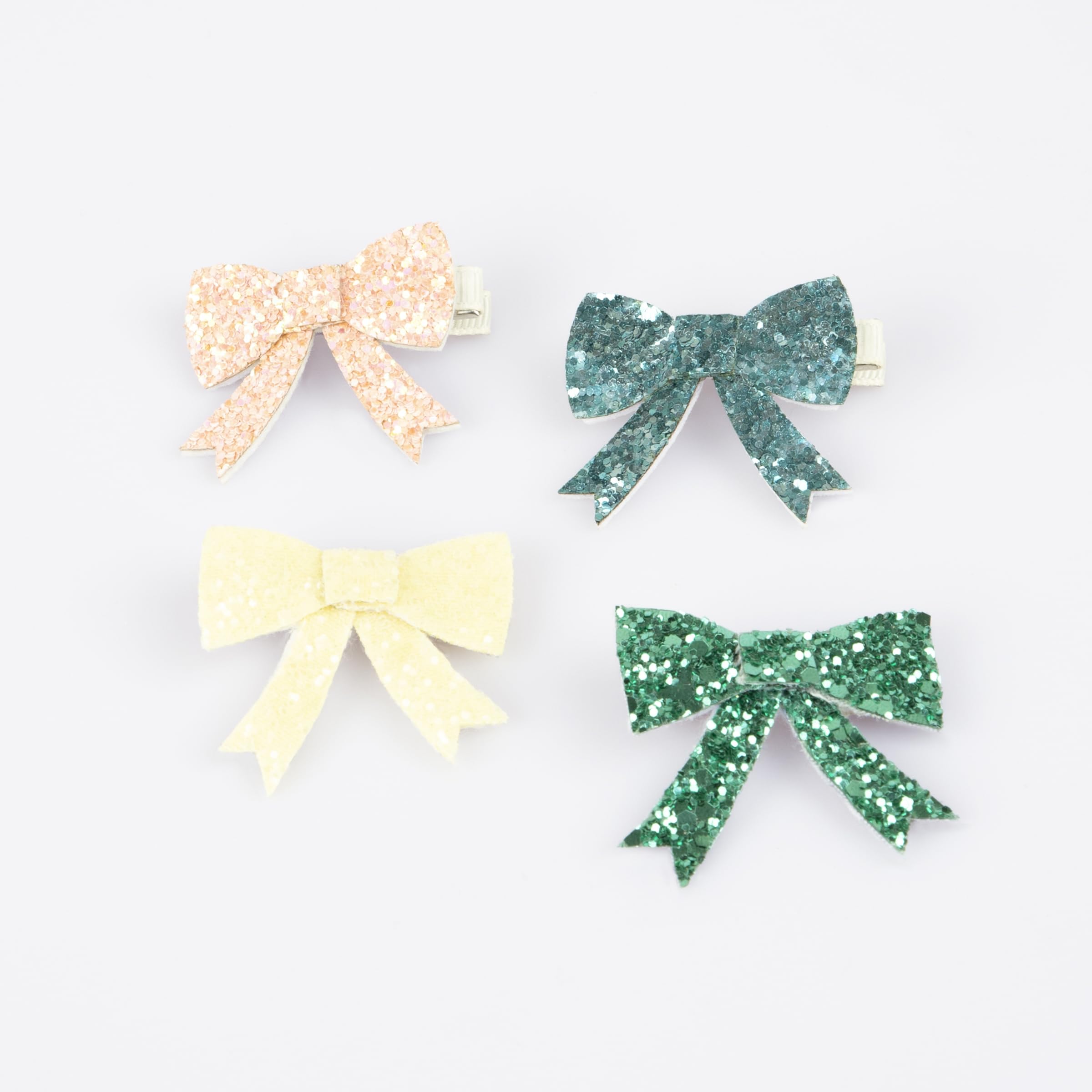 Meri Meri glitter bow hair clip in peach adds playful shine to party looks