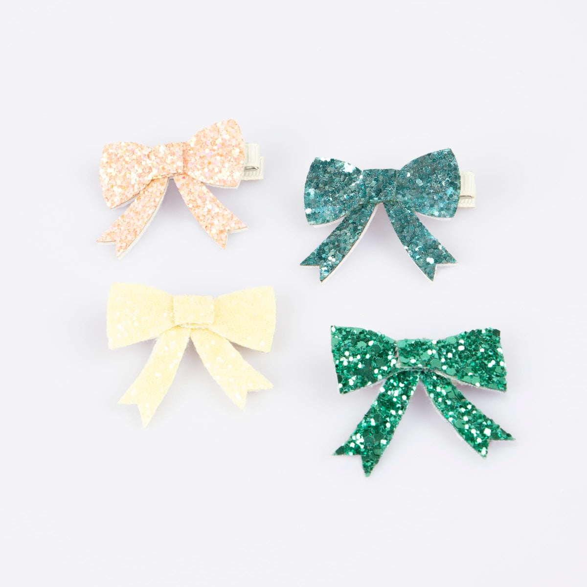 Meri Meri glitter bow hair clip in peach adds playful shine to party looks
