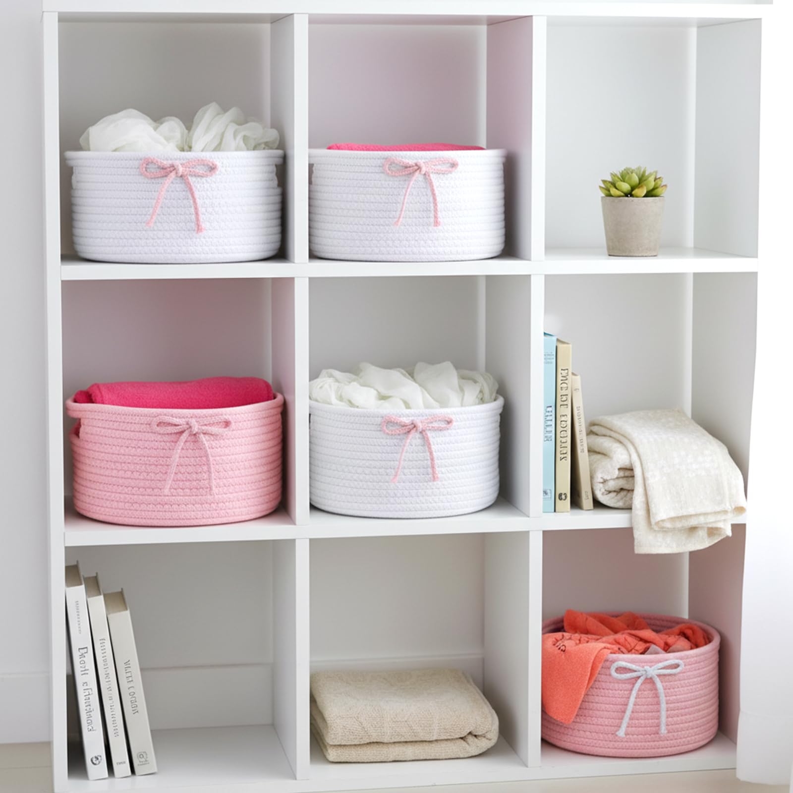 Meyeyaia Coquette Bow Hamper in living room for small-item storage.