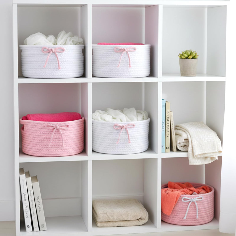 Meyeyaia Coquette Bow Hamper in living room for small-item storage.