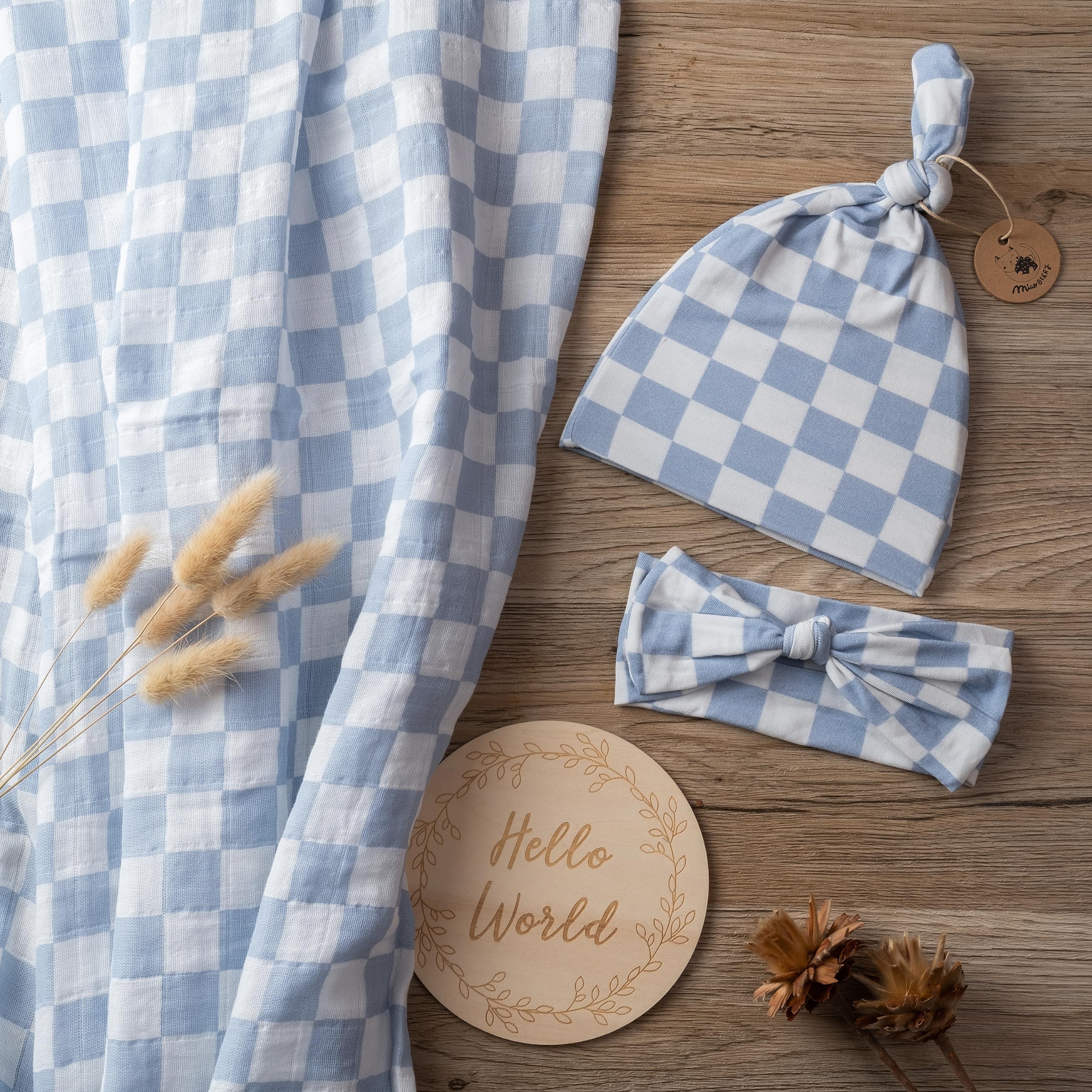 Miaoberry checkered muslin swaddle mist blue hat demonstrates matching outfit
