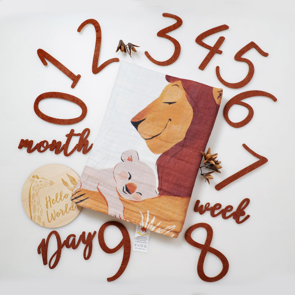 Miaoberry Safari Milestone Blanket used with props during newborn photos.