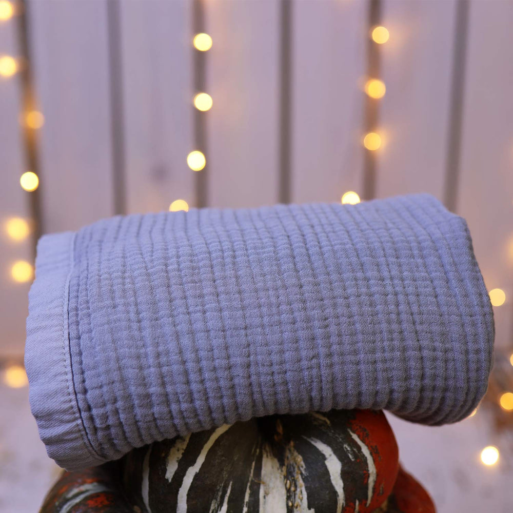 Migaloo easy-care blanket machine washes cold and softens over time.