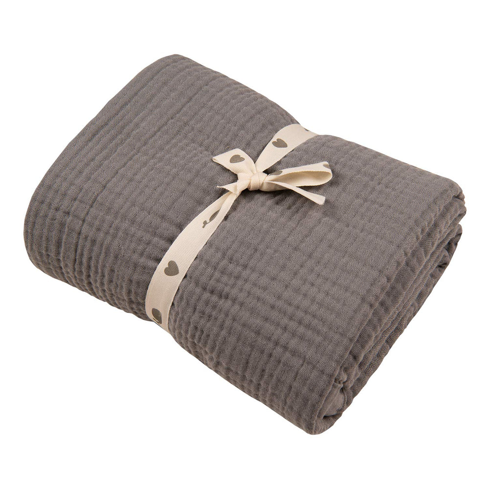 Migaloo Sharkskin Muslin Blanket with four layers folded for cozy swaddling.