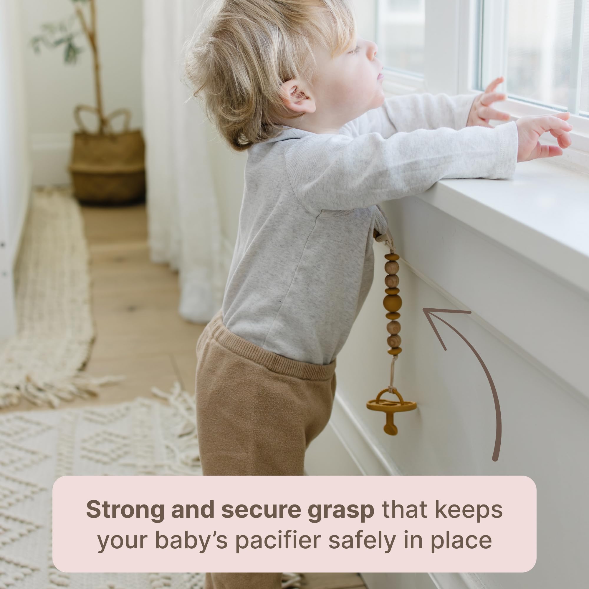 Mila & Lulu easy-clean pacifier clip, wipeable and travel-friendly.