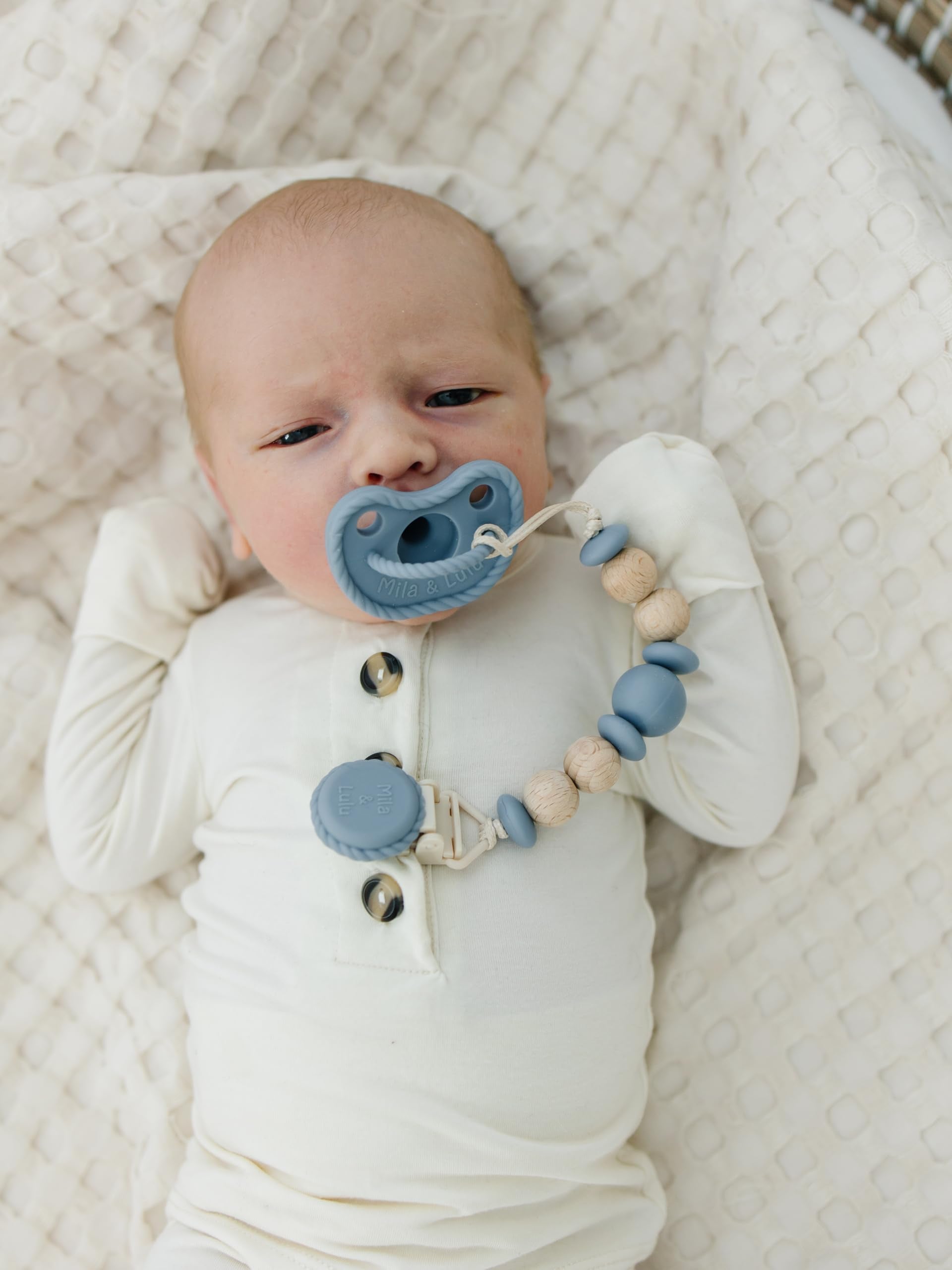 Mila & Lulu olive shield pacifier promotes airflow and comfort for baby